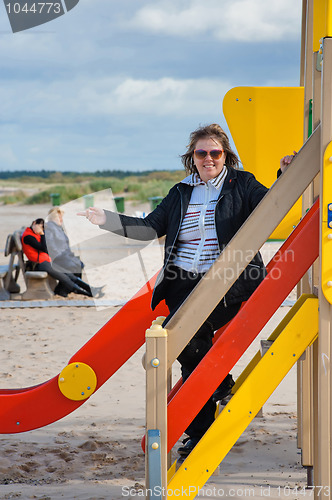 Image of Woman relaxing in dune