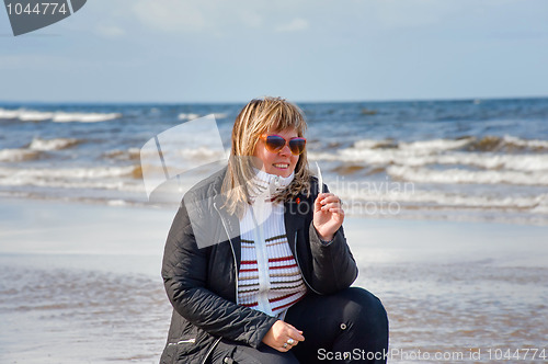 Image of Woman relaxing at the sea.