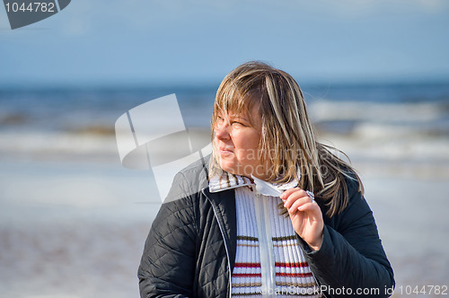 Image of Woman relaxing at the sea.