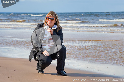 Image of Woman relaxing at the sea.