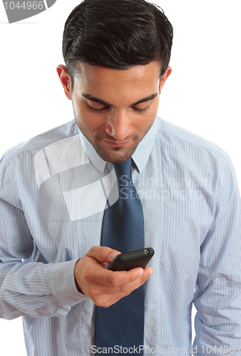 Image of Businessman texting SMS