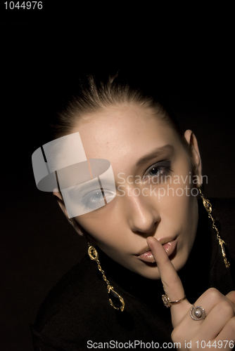 Image of Woman making silence gesture