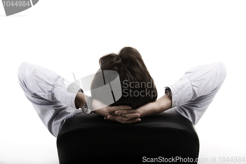 Image of Man resting on the arm-chair  