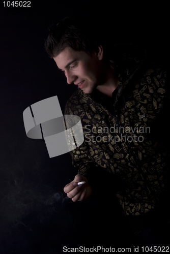 Image of portrait of a young man with cigarette  