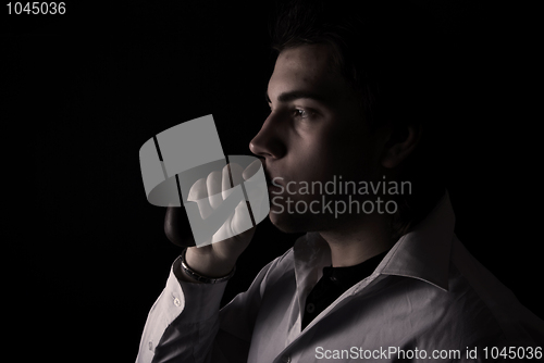 Image of portrait of a young man with pipe