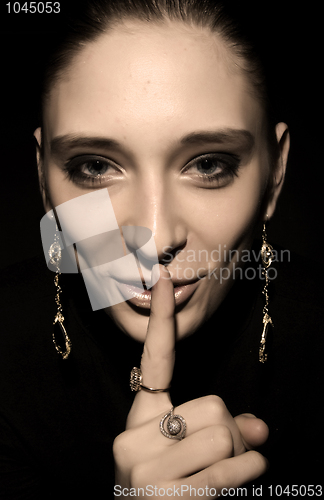 Image of Woman making silence gesture