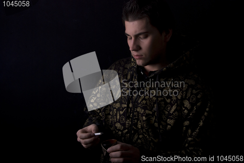 Image of portrait of a young man with cigarette 