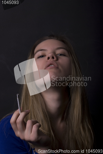 Image of portrait of a young girl with cigarette  