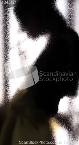 Image of Girl behind the glass  