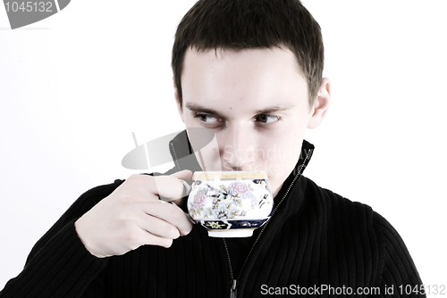 Image of young man with a cup of tea