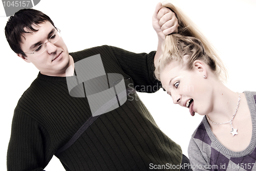 Image of man pulling hair of the girl   