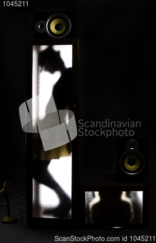 Image of A girl behind the glass door            