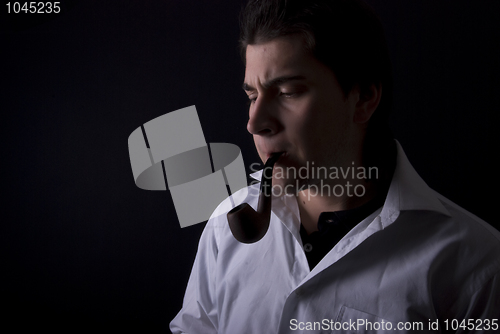 Image of man smoking pipe