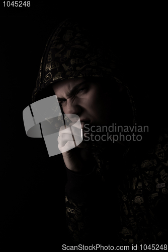 Image of portrait of a young man with cigarette  