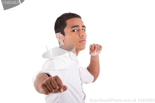 Image of Portrait of a very happy  young latin man with his arms raised