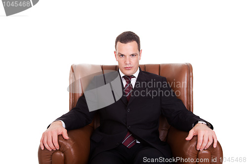 Image of Businessman seated on a chair