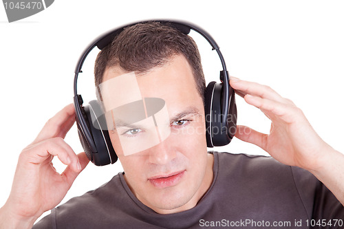Image of man listening music in headphones