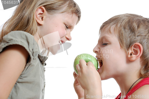 Image of children with  an apple