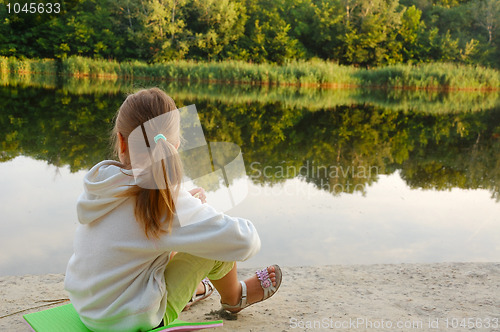 Image of child relaxing on the beach