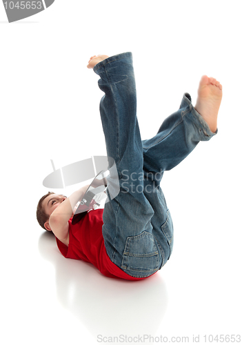 Image of Fun little boy playing a guitar