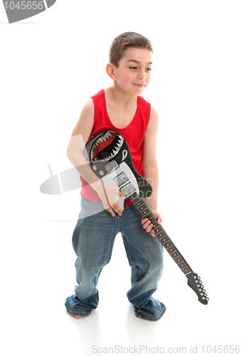 Image of Little musician playing a guitar