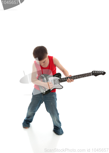 Image of Little boy playing a guitar