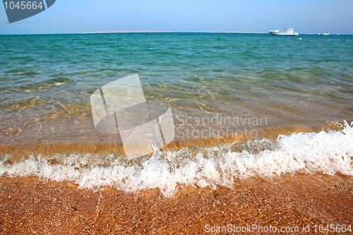 Image of sea waves and gold sand beach