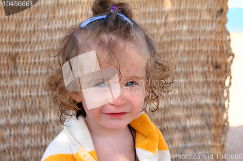 Image of girl in towel on beach