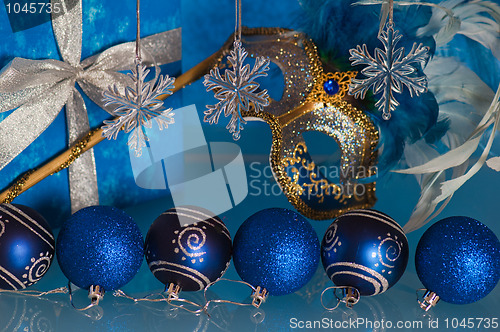 Image of  New Year's and Christmas ornaments and a carnival a mask