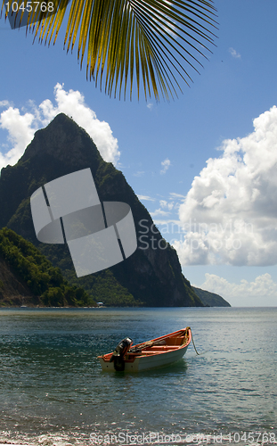 Image of soufriere st. lucia twin piton mountain peaks with fishing boat 