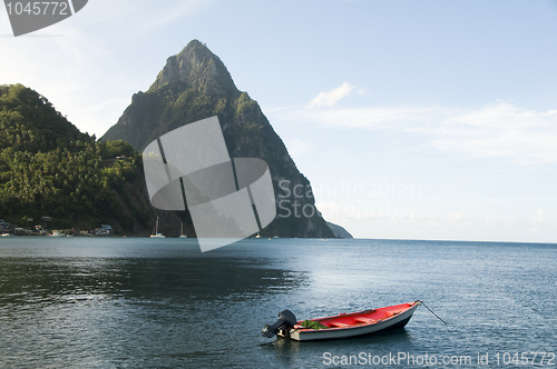 Image of soufriere st. lucia twin piton mountain peaks with fishing boat 