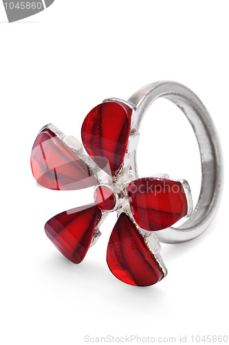 Image of Finger ring with red stone flower isolated