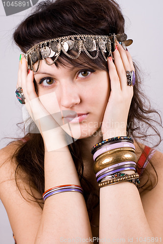 Image of brunette lady with bracelets