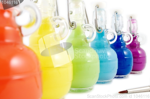 Image of Colorful flasks and brush