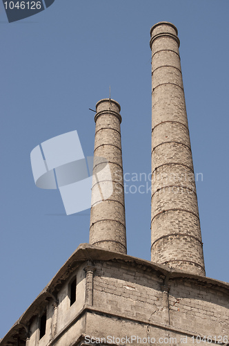 Image of Old Abandoned factory chimneis