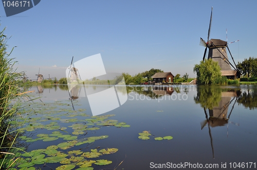 Image of Dutch mill reflecting in a canal