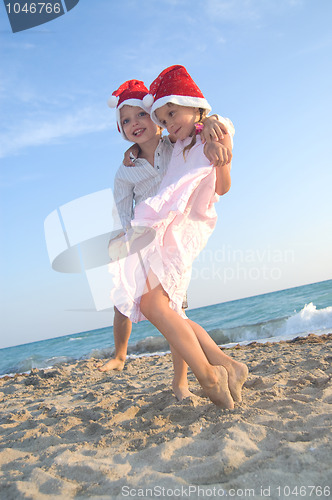 Image of Santa kids at the summer beach