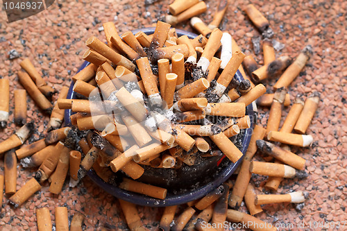 Image of ashtray full of cigarettes close-up