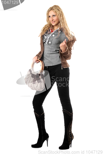 Image of Beautiful playful young blonde with a handbag