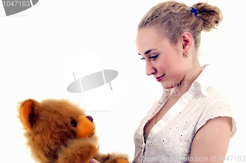Image of Young woman with teddy bear  