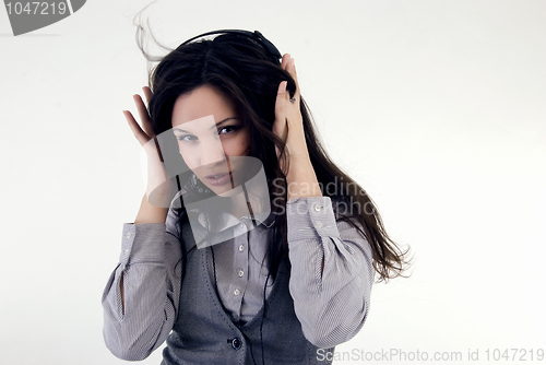 Image of Young girl in headphones   