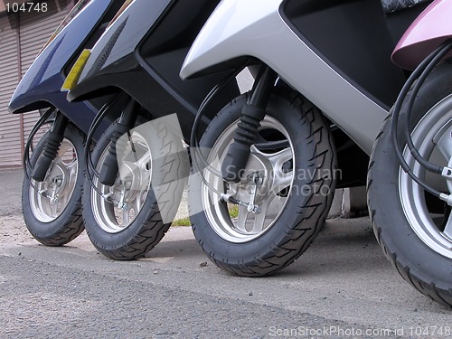 Image of Scooter wheels in a row
