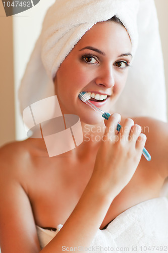 Image of Woman brushing teeth