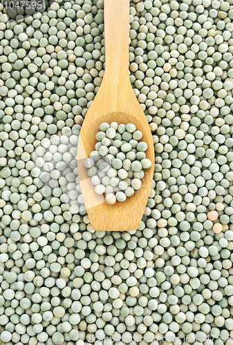 Image of Wooden spoon and dried green split peas