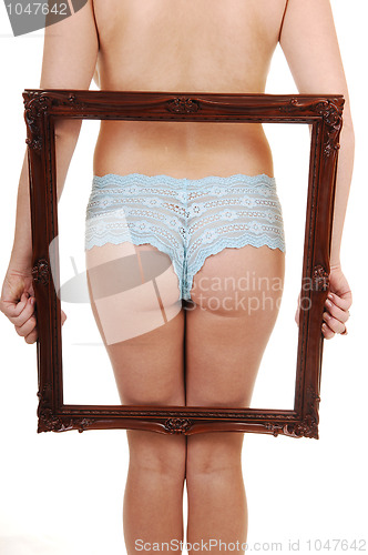 Image of Girl holding frame up.