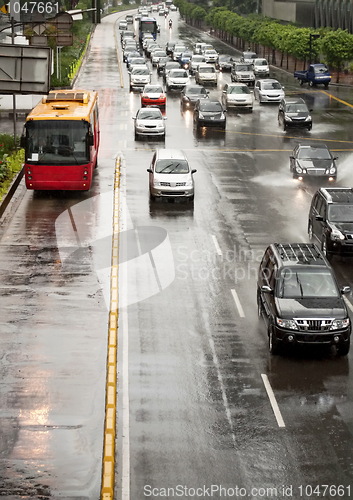 Image of Car Driving On Flooded Street