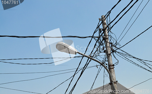 Image of Streetlight pole with cables