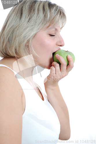 Image of young woman biting an apple
