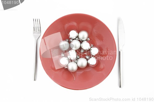 Image of red plate with Christmas silver ball