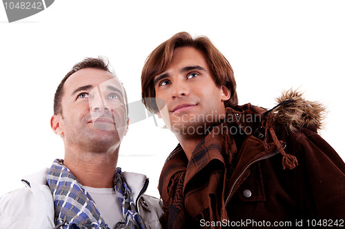 Image of two casual men looking up, 